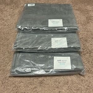 Bath towels. Brand new in plastic wrap, 100% cotton light gray.